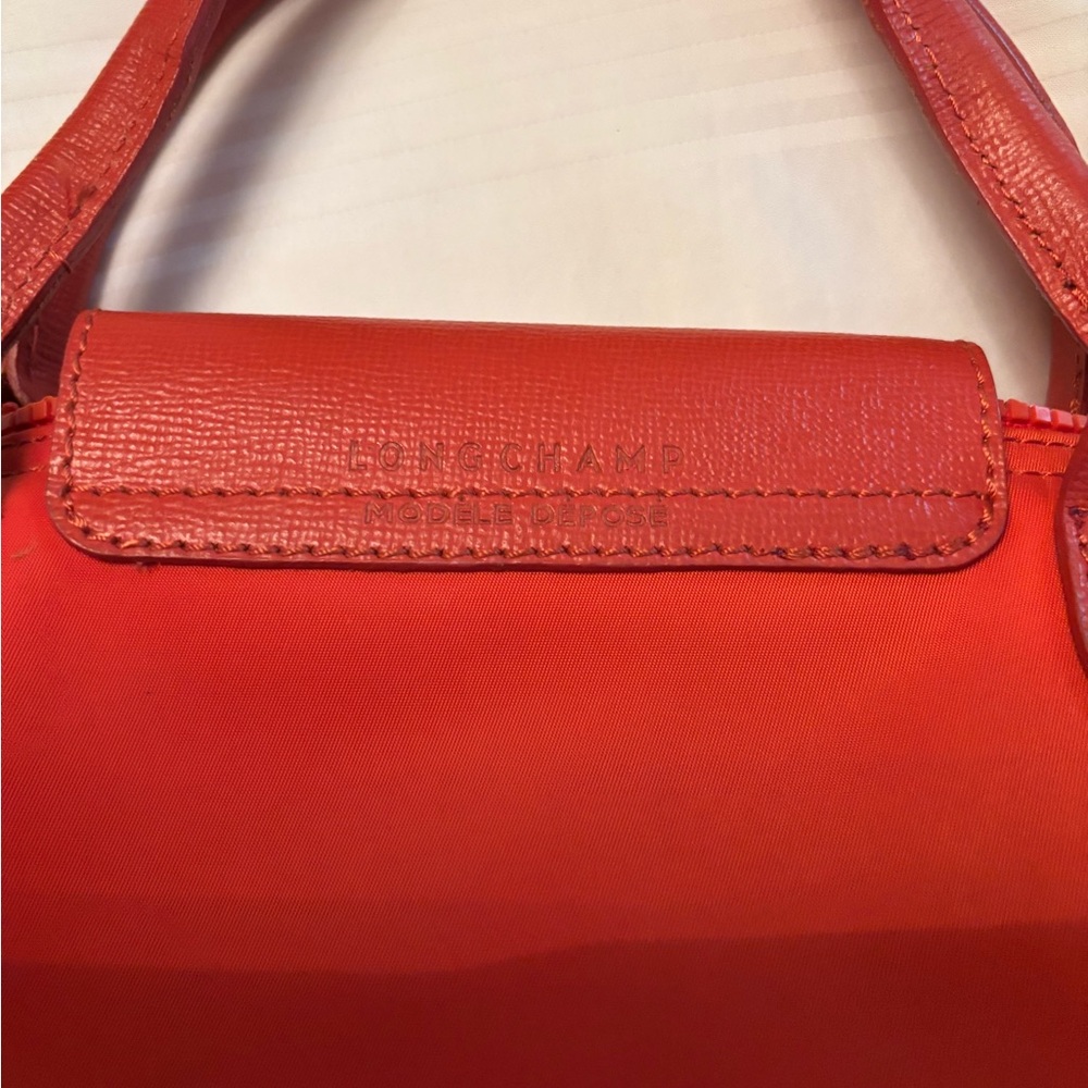 Coral/orange with detachable strap. VERY good condition. - Picture 3 of 5